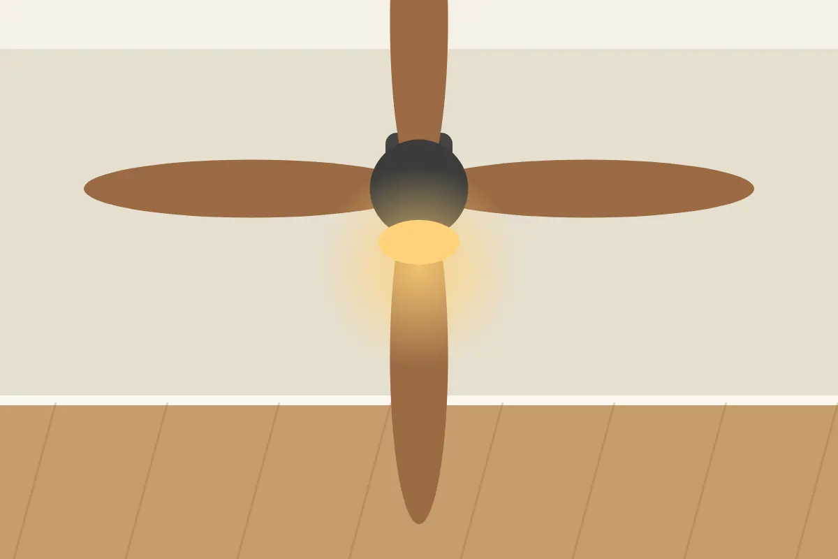 Wooden ceiling fan with a glowing light kit in a warm room